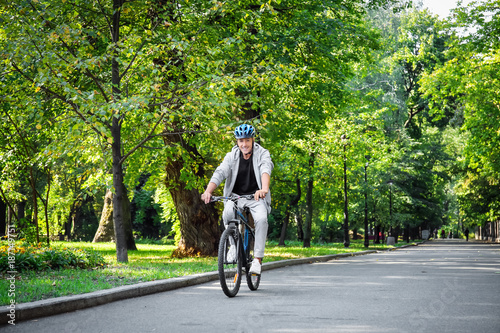 Wallpaper Mural Mature sporty man riding bicycle outdoors Torontodigital.ca