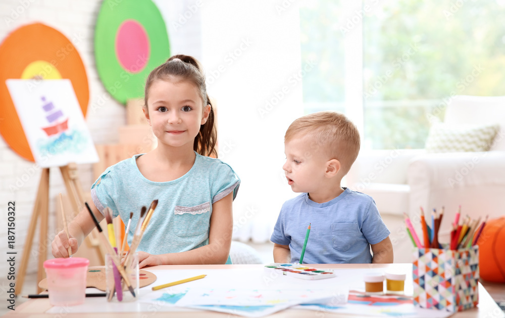 Fototapeta premium Little children drawing at table indoors