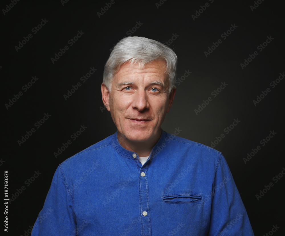 Portrait of handsome mature man on dark background Portrait of handsome mature man on dark background