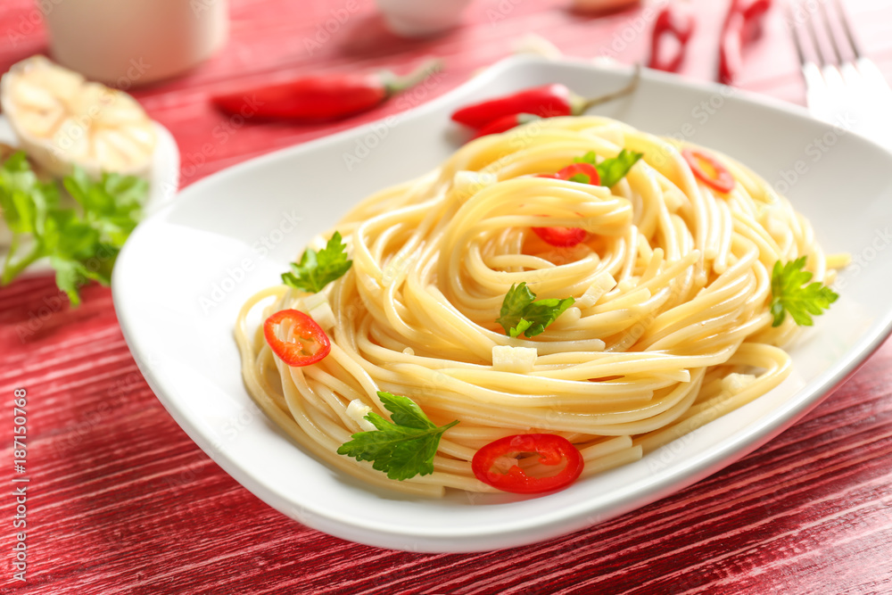 Delicious pasta with garlic and chili pepper on plate Delicious pasta with garlic and chili pepper on plate