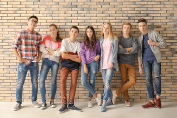 Group of cool teenagers indoors