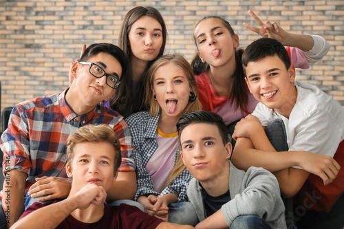 Group of funny teenagers indoors