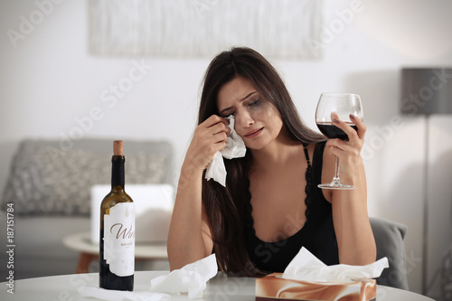 Depressed young woman cryin...