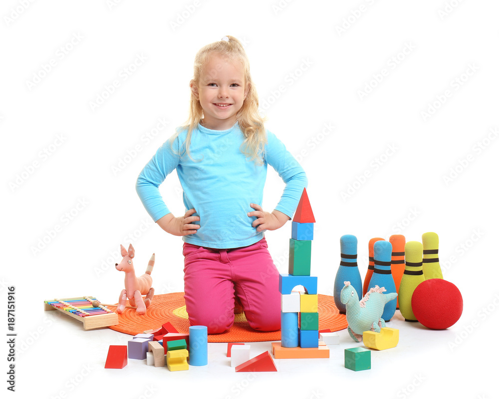 Cute little girl playing with building blocks on white background Cute little girl playing with building blocks on white background