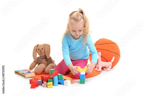 Cute little girl playing wi...