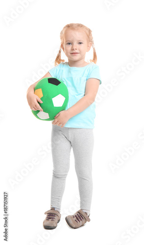 Cute little girl holding ba...