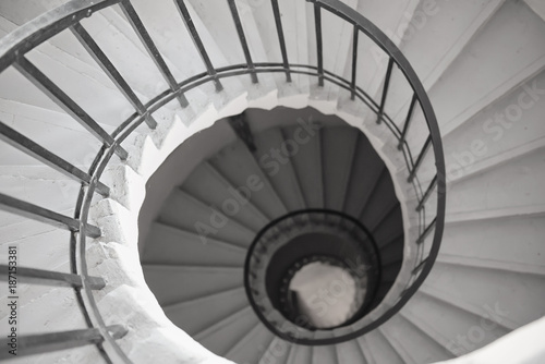 View to the circle spiral staircase in old building  black and white