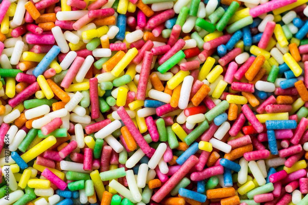 Closeup of a pile of colourful sugar sprinkles (cake decor), from above