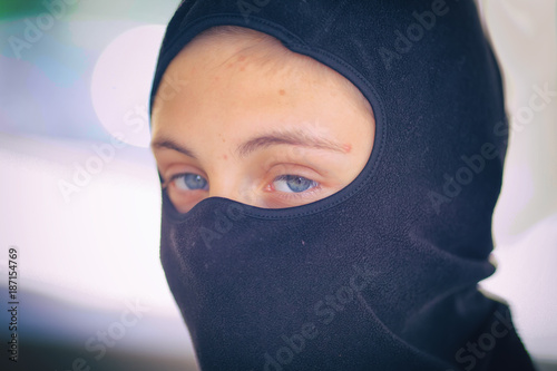 фотографія Teenager in a black mask