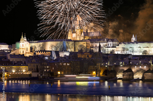 Sticker Fireworks above night colorful snowy Prague gothic Castle with Charles Bridge, C
