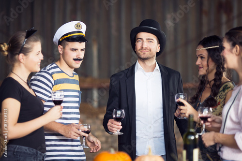 Canvas Print Group of adults drinking and having fun on halloween party