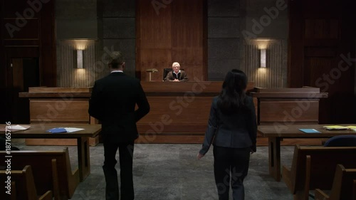 Lawyers in a modern court room arguing a legal case in a judiciary battle in front of a judge