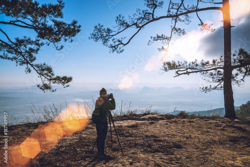 photographer Asian women  asians travel relax in the holiday. Photograph mountain landscapes atmosphere in the morning. In the winter. In Thailand photo