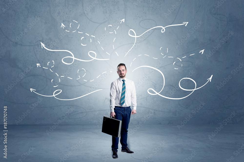 Businessman standing with winding arrows around Businessman standing with winding arrows around