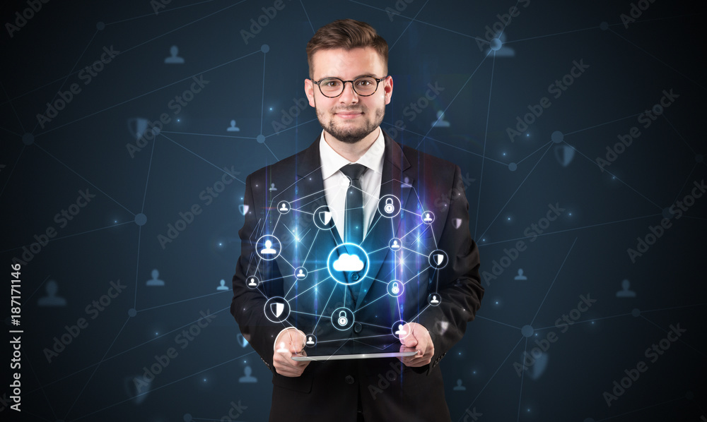 Secured cloud concept with businessman and tablet Secured cloud concept with businessman and tablet