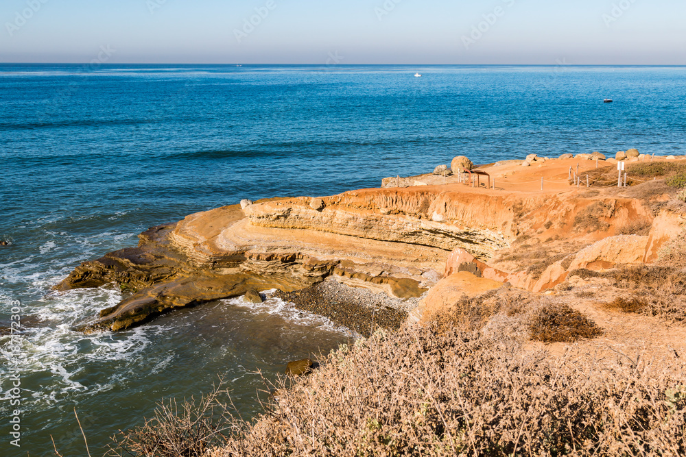 Eroded cliffs at the tidepool area during high tide at Cabrillo National Monument in Point Loma, California.  