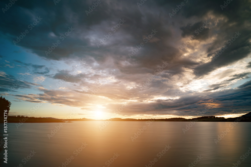 Naklejka premium Sunset over lake.