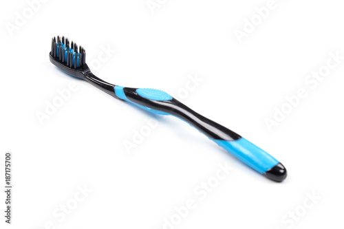 Toothbrush black and blue isolated white background.