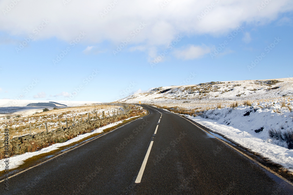 A4059 main road connecting the A465 to the A470 leading to Pen y Fan and the Brecon Beacons National Park. Road trip in the snow. A4059 main road connecting the A465 to the A470 leading to Pen y Fan and the Brecon Beacons National Park. Road trip in the snow.