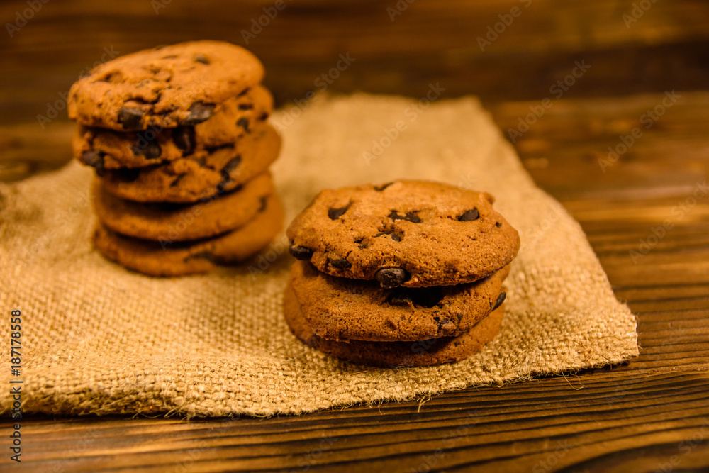 Chocolate chip cookies on sackcloth on a wooden table Chocolate chip cookies on sackcloth on a wooden table