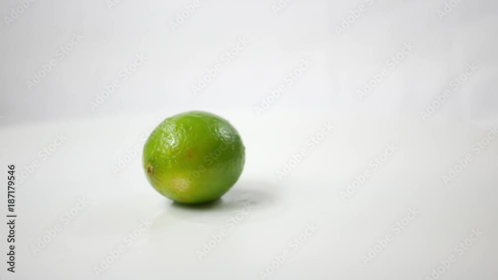 Citrus Vibrant Green Lime spinning over white ALT
