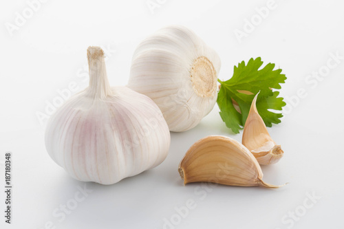 garlic with leaves of parsley isolated