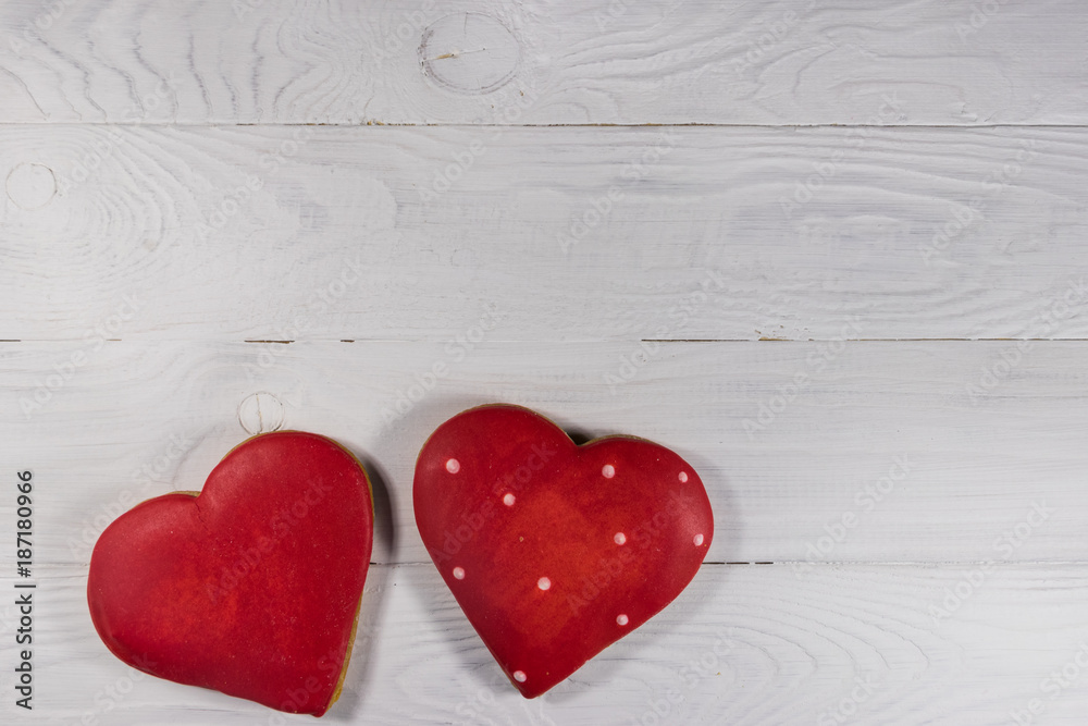 Heart shaped cookies for valentine day on white wooden table. Top view Heart shaped cookies for valentine day on white wooden table. Top view