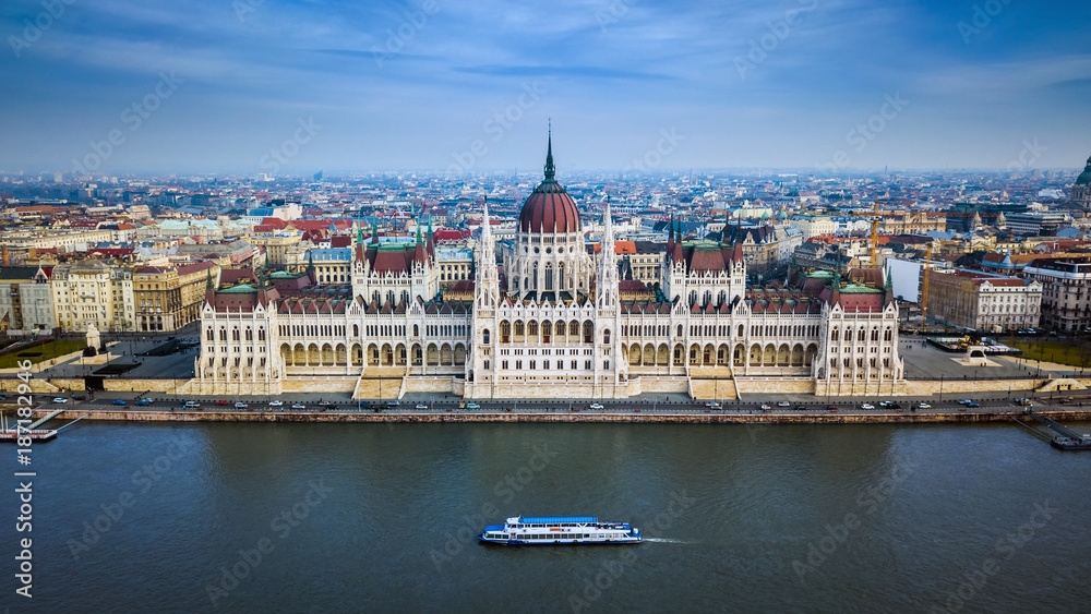 Obraz premium Budapest, Hungary - Aerial skyline view of the Parliament of Hungary with sightseeing boat on River Danube