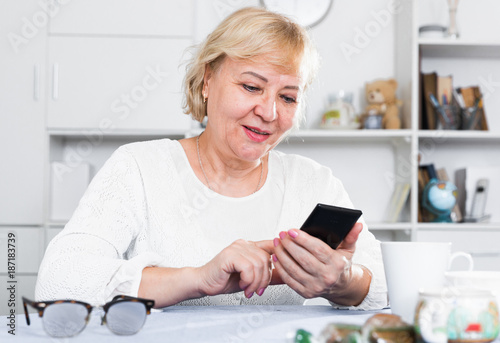 Mature woman with smartphone