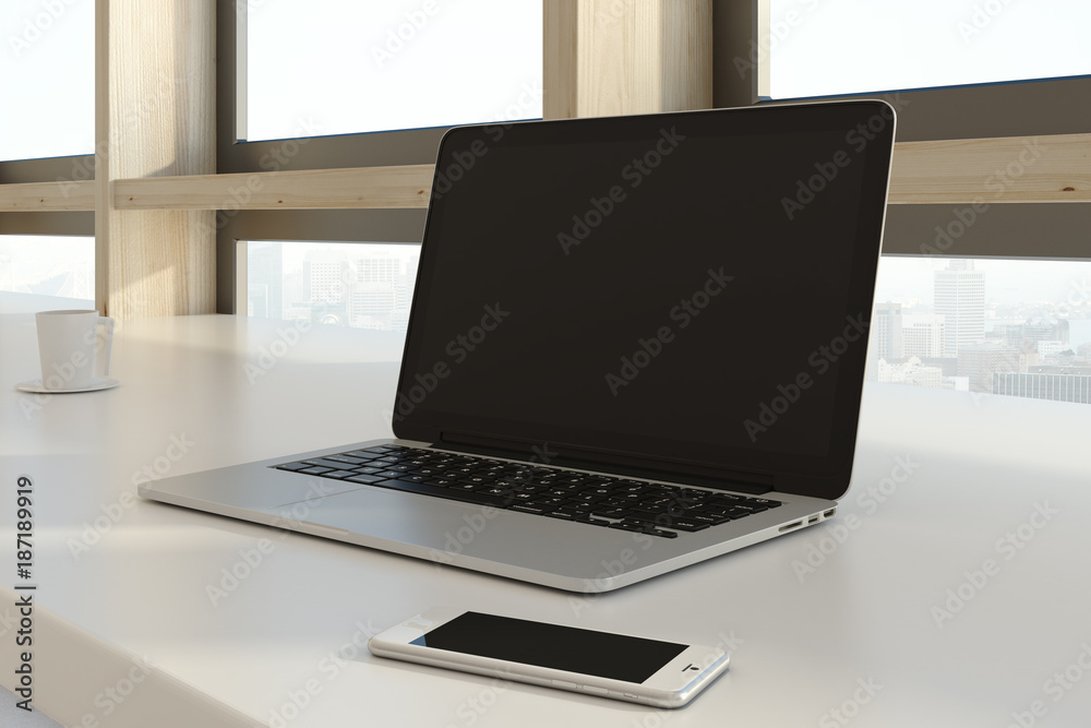 Empty laptop and smartphone Empty laptop and smartphone
