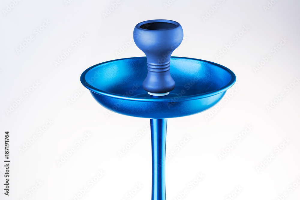Upper part of a hookah, a bowl for tobacco of blue color, isolated on a white background. Modern blue hookah. Upper part of a hookah, a bowl for tobacco of blue color, isolated on a white background. Modern blue hookah.
