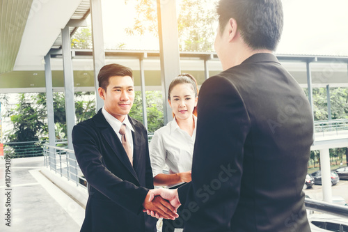 Asian Business Handshake at city outside office Success concept photo