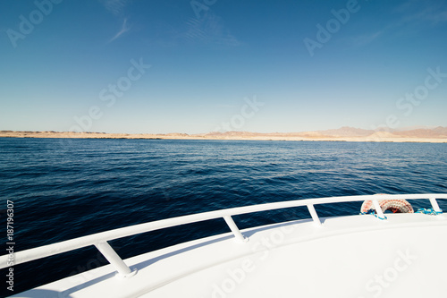 Wide angle shot of front of the deck yacht in summer time