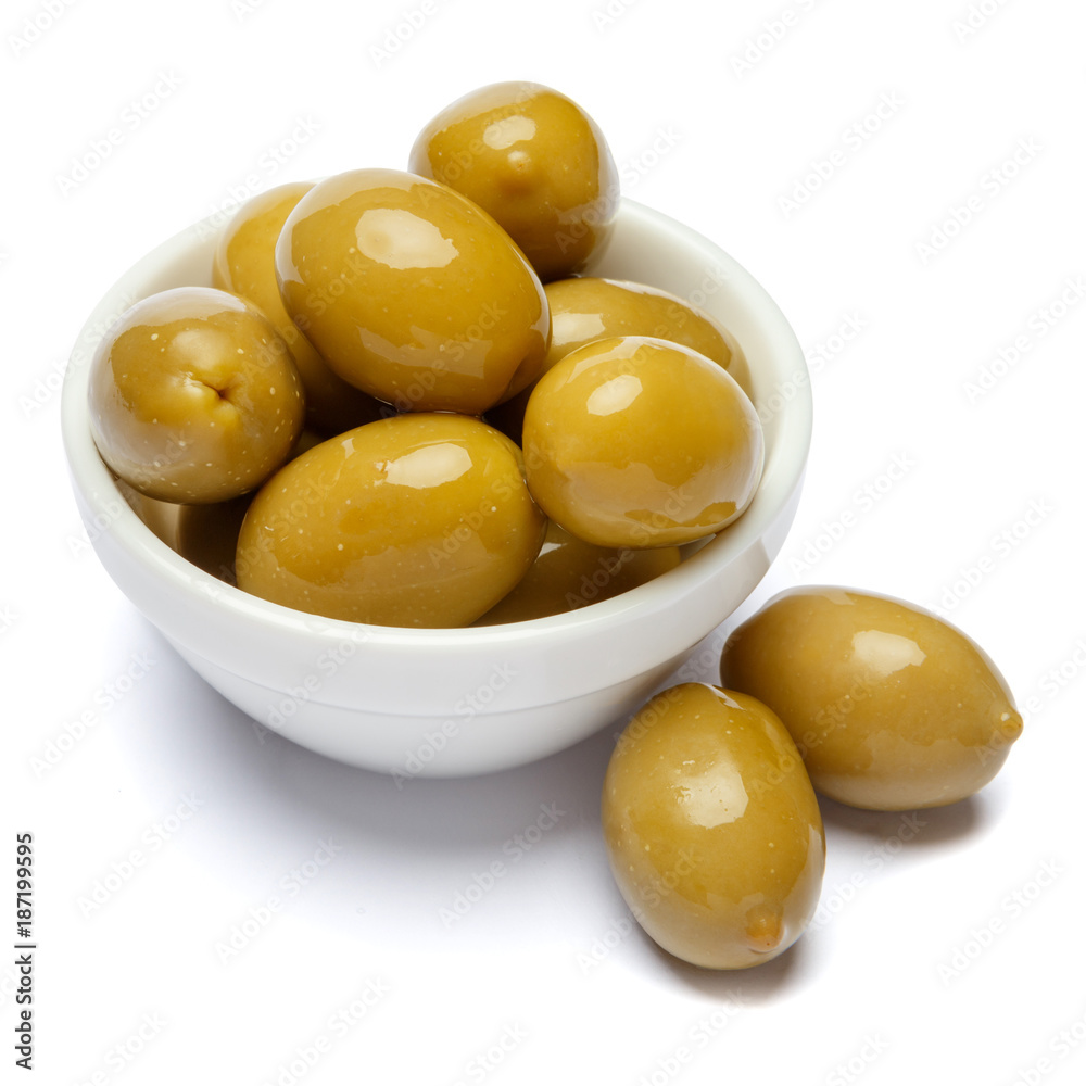 green olives in white bowl on white background green olives in white bowl on white background