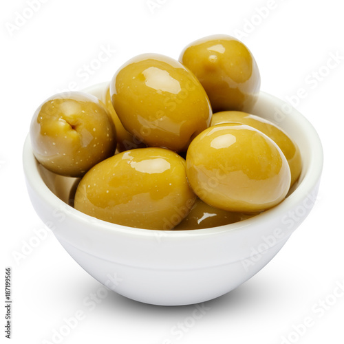 green olives in white bowl on white background
