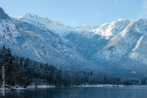 Mountains with snow over the lake © chechotkin