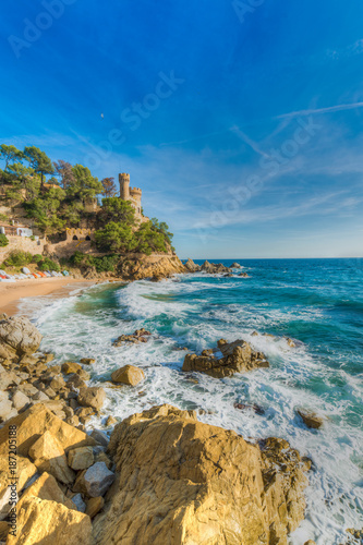 Rugged rocky coast with the D'en Plaja Castle in the background - Lloret de Mar - Costa Brava - November 2014