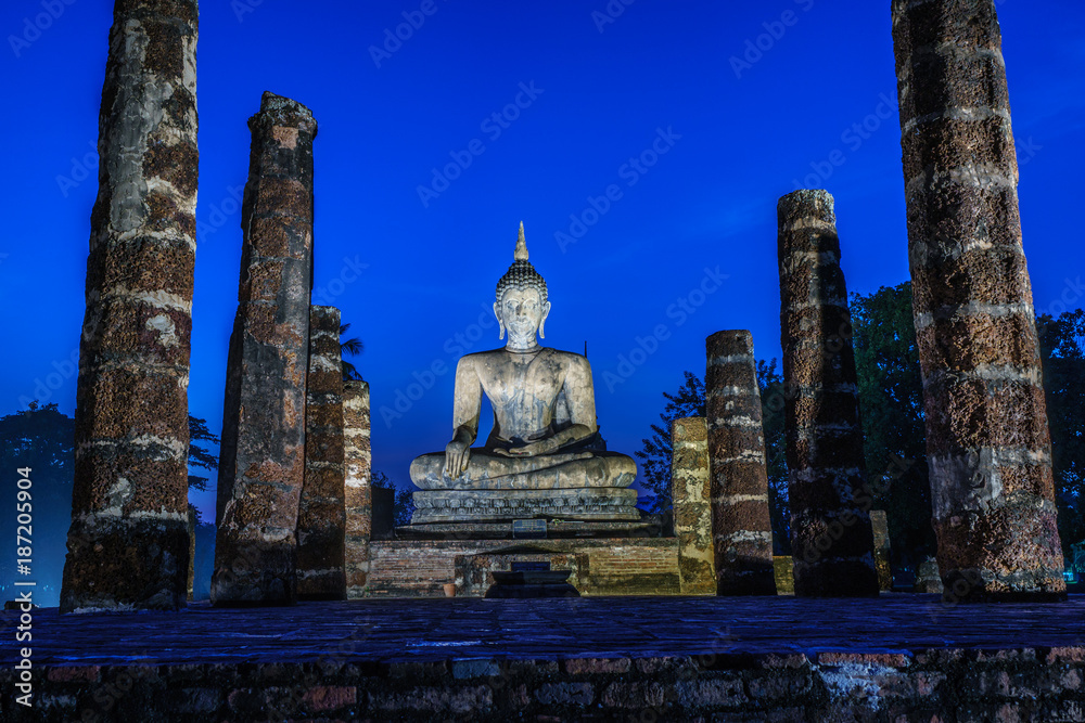 Ancient Buddha Statue  world heritage site Sukhothai historical park Light up