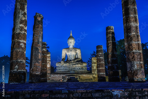 Ancient Buddha Statue  world heritage site Sukhothai historical park Light up