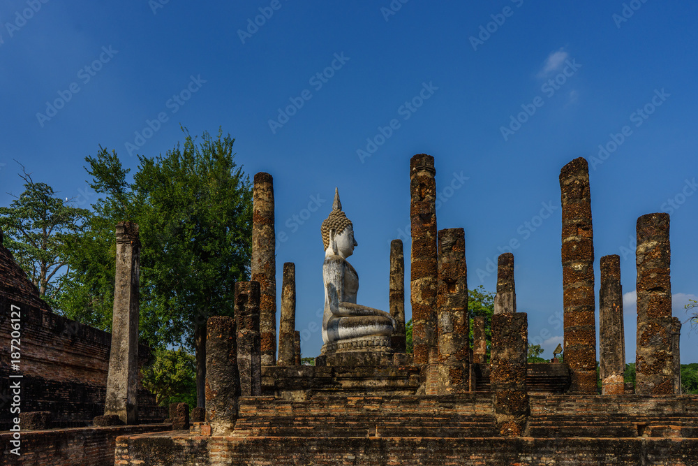 Side view of Ancient Buddha Statue  world heritage site Sukhothai historical park