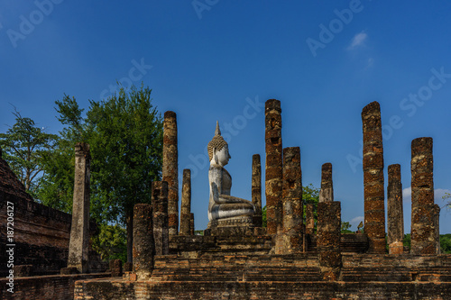 Side view of Ancient Buddha Statue world heritage site Sukhothai historical park