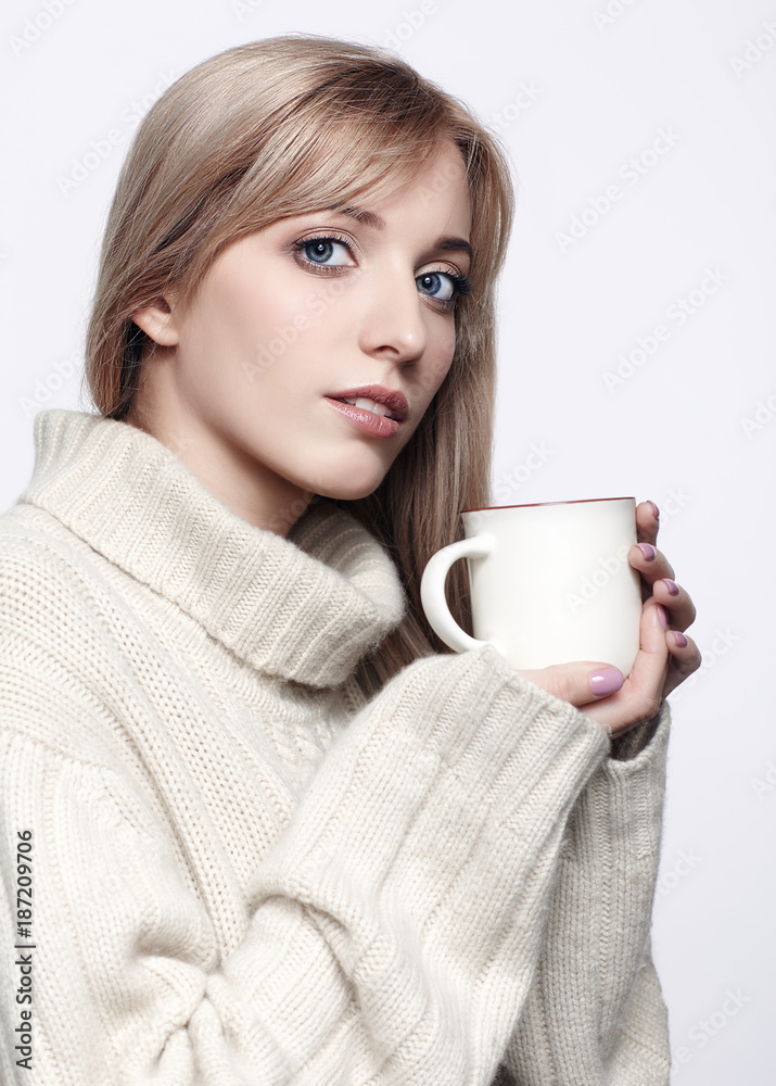 Blonde woman drinking a cap of hot chocolate Blonde woman drinking a cap of hot chocolate