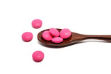 Top view of pink ibuprofen pills on white background for healthcare and medical concept