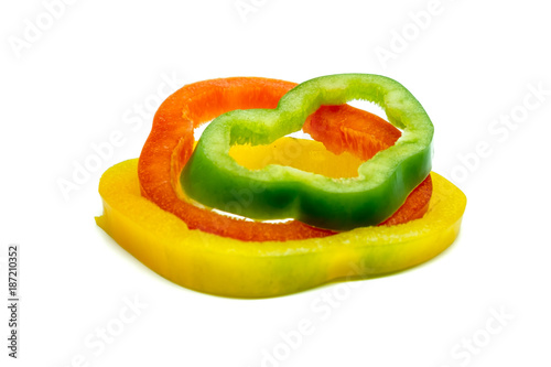 Sliced sweet pepper or bell pepper or Capcicum with three colour (green, red and yellow) on white background food ingredients concept