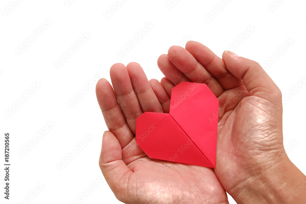 Hand holding red heart paper origami on white background for Valentine's day and love concept Hand holding red heart paper origami on white background for Valentine's day and love concept