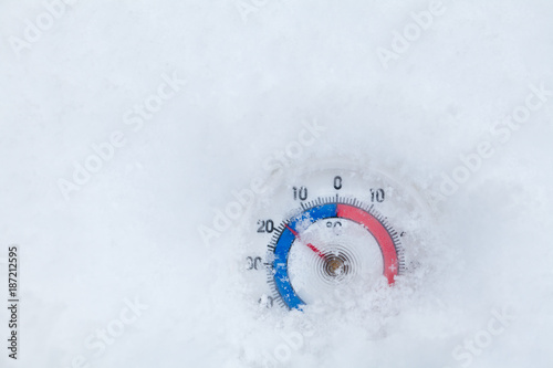 Frozen thermometer shows minus 17 Celsius degree cold winter weather concept photo