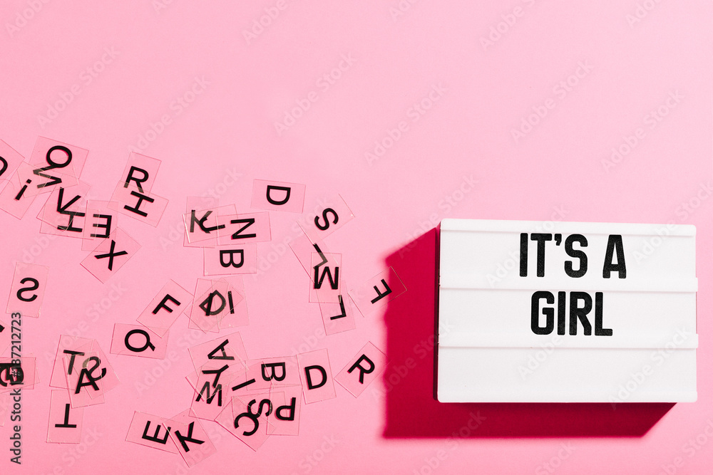 Light box with girl baby announcement on pink background Light box with girl baby announcement on pink background