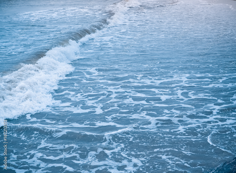 Fototapeta premium Beautiful wave of the sea on the sand beach. Used for landscape background.