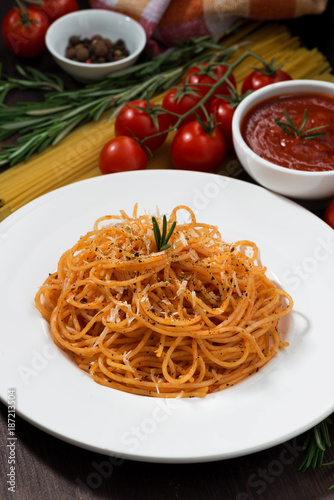 plate of spaghetti with tomato sauce, vertical, closeup