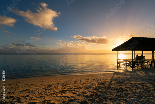 Relaxing on remote Paradise beach at sunset ,"Flic an flac" beach,Mauritius island. 